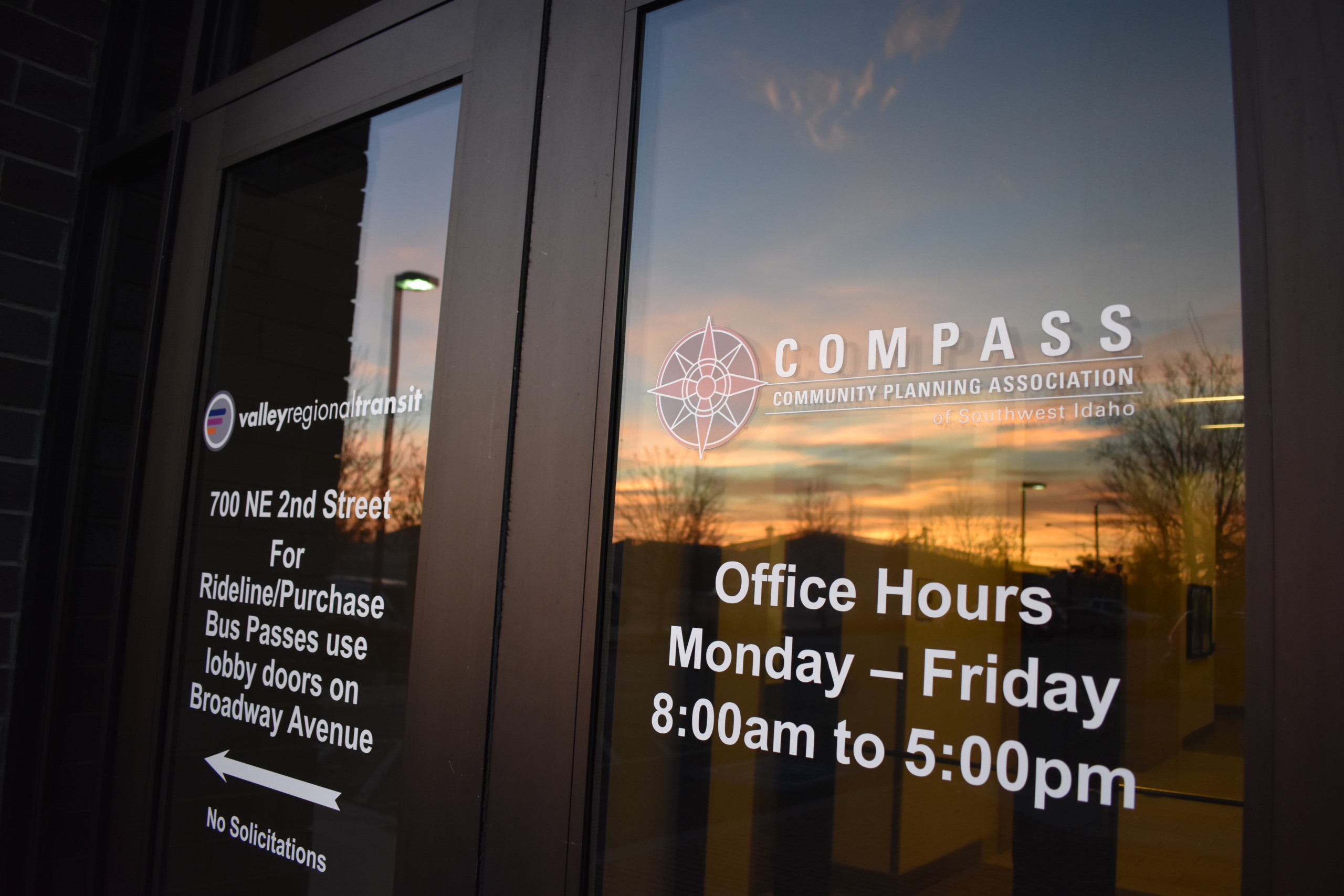 COMPASS building, front door at dusk